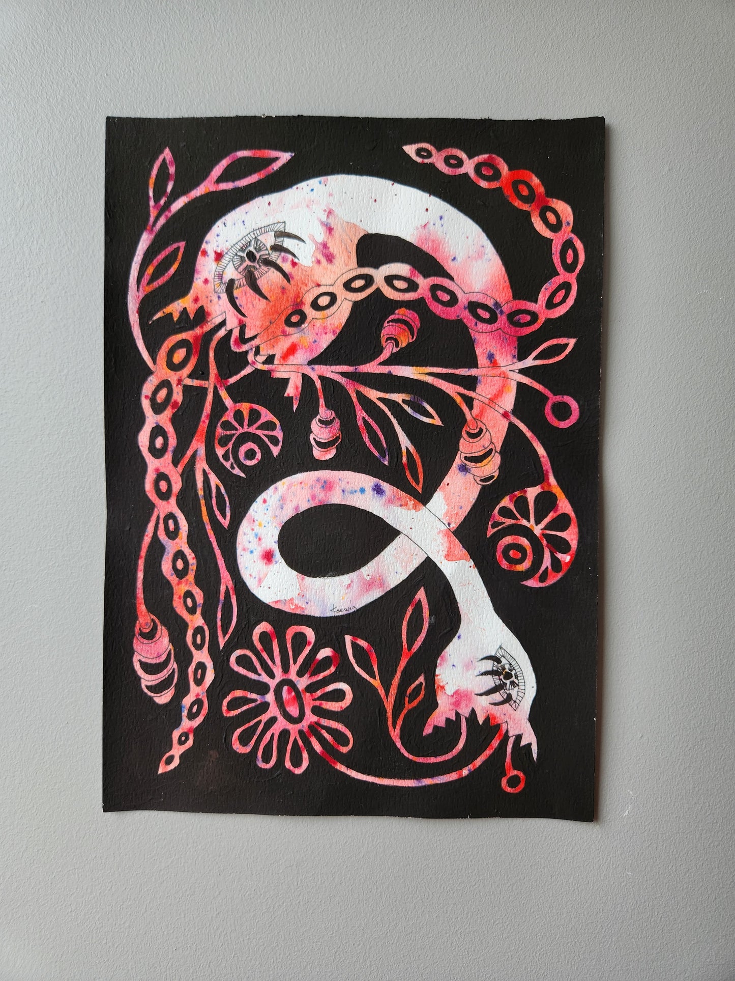 Original painting of a mystical snake with floral and tentacle motifs in pink, red, and violet hues on black background. Hand-painted folk-inspired serpent artwork, photographed on neutral wall, perfect for fantasy and myth-themed wall decor.