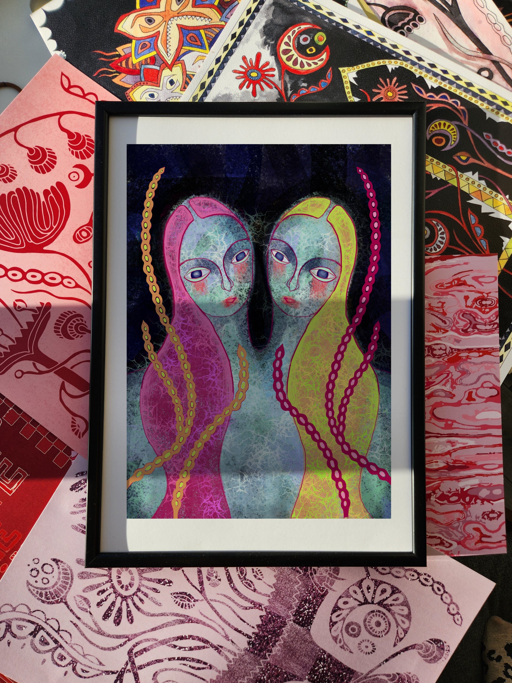Maximalist wall art print with two surreal female portraits, bold pink and yellow tones, layered patterns and symbolic details, eclectic poster.